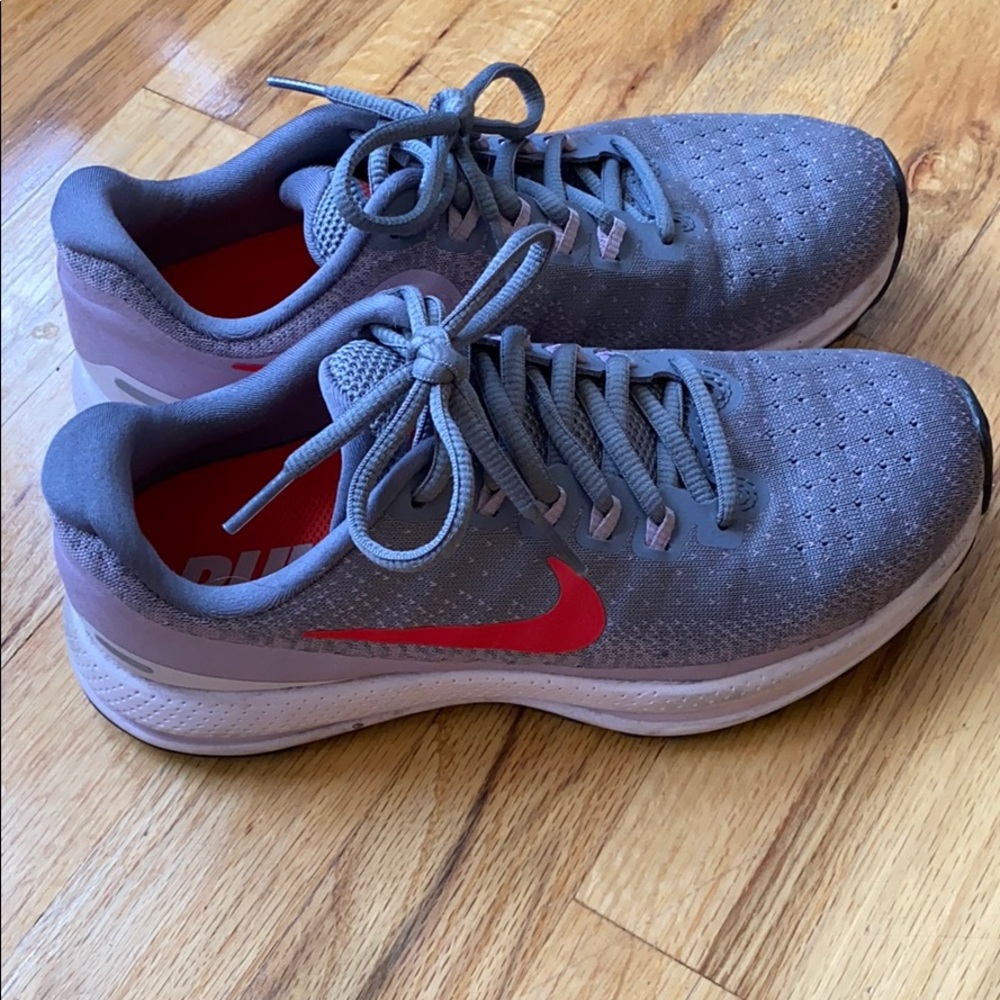 Purple and red Nike Zoom running shoes
